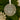 A clear ornament hanging on a Christmas tree, with the text "First Christmas as Grandparents" and "Love Abella x" printed on it.