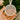 A hand holding a round ornament with the text "First Christmas as Mr & Mrs Roberts" and "Louise & David 2025" on it.