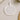 A round, clear ornament with a white floral design and text that reads "First Christmas as Mr & Mrs Roberts Louise & David 2025".