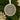 A round ornament hanging on a Christmas tree, featuring a floral design and text that reads "First Christmas as Mr & Mrs Roberts Louise & David".