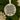 A Christmas ornament with the text "Our First Christmas Engaged" and the names "Charlotte & Matthew" printed on it, hanging on a tree branch.