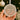 A hand holding a round ornament with the text &quot;First Christmas as Mr & Mrs Roberts Louise & David 2020&quot; on it.